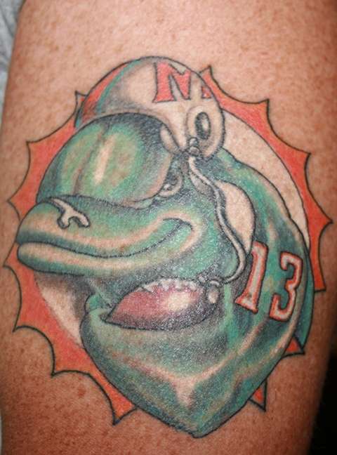  Miami Dolphins The first tattoo of the dolphin with a football 