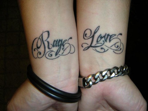 Rage and Love wrist tattoos.