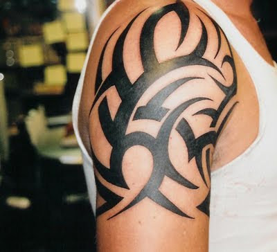 Dark bold tribal shoulder tattoo