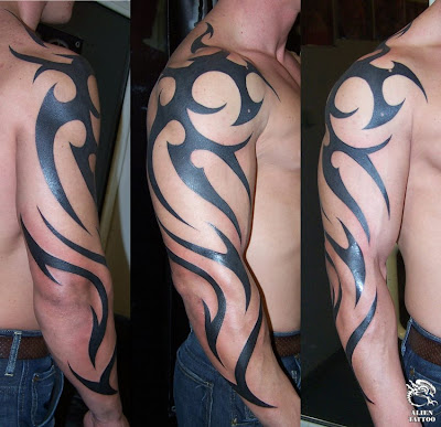 Large tribal arm tattoo.
