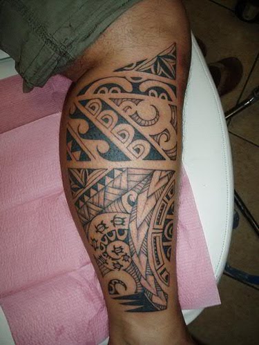 Polynesian tribal leg tattoo.