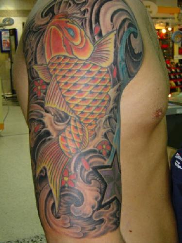 Colorful arm tattoo. Complex tribal make a tattoo online zodiac tribal