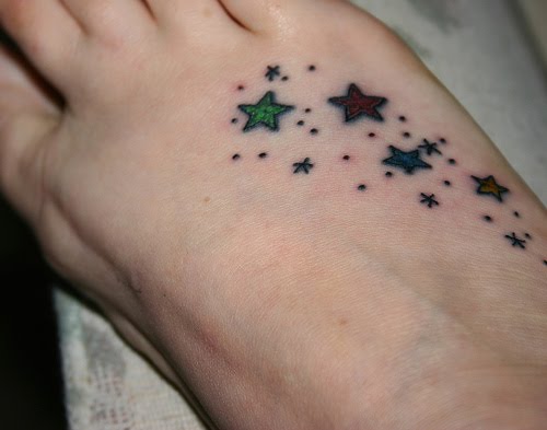 Small stars foot tattoo idea for women