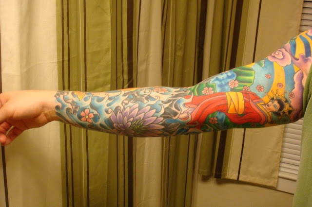 Japanese sleeve tattoo ideas below Flowers clouds and flames design