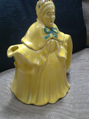 Teapot in the shape of a jaundiced geriatric Victorian woman