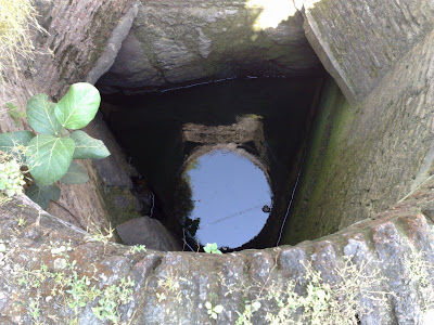 A Triangular Well with Round Mouth.