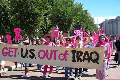 protest photo with banners that says Get U.S. Out of Iraq