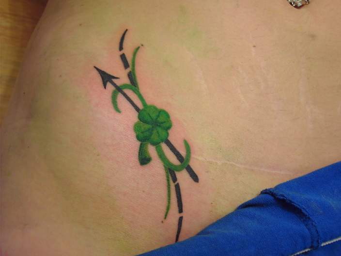 Clover tattoos Flower tattoos can also be seen encircling four leaf clover 