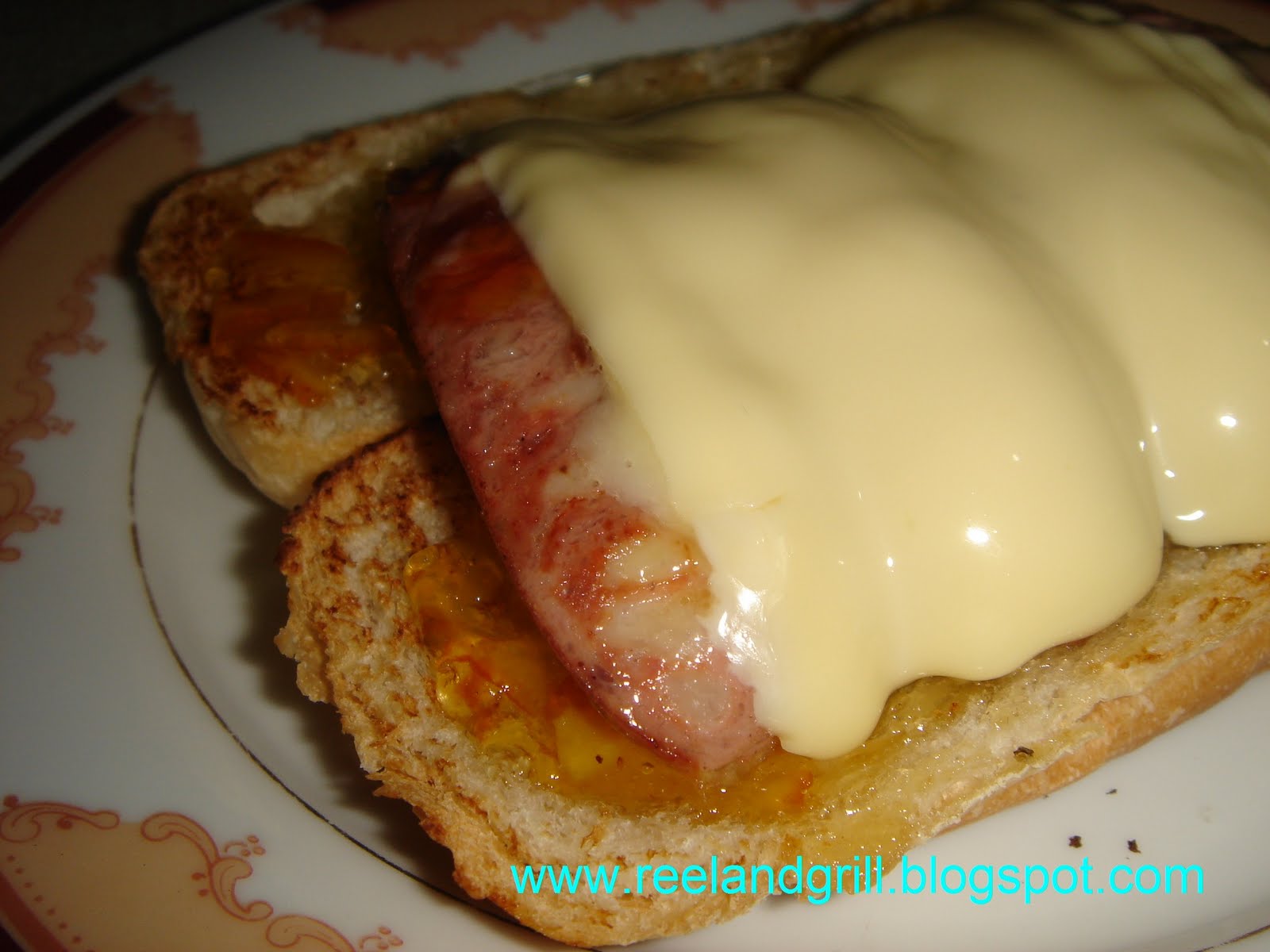 Reel and Grill Sausage Sandwich with Cheese and Orange Marmalade