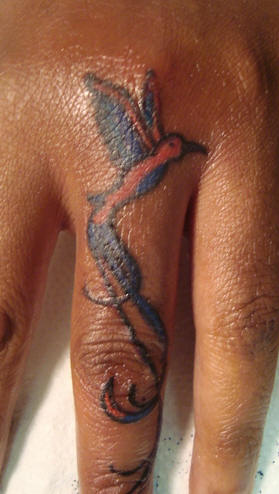 humming bird tattoo. Humming bird finger tattoo