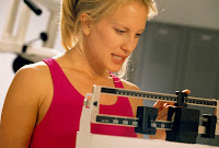 woman weighing herself