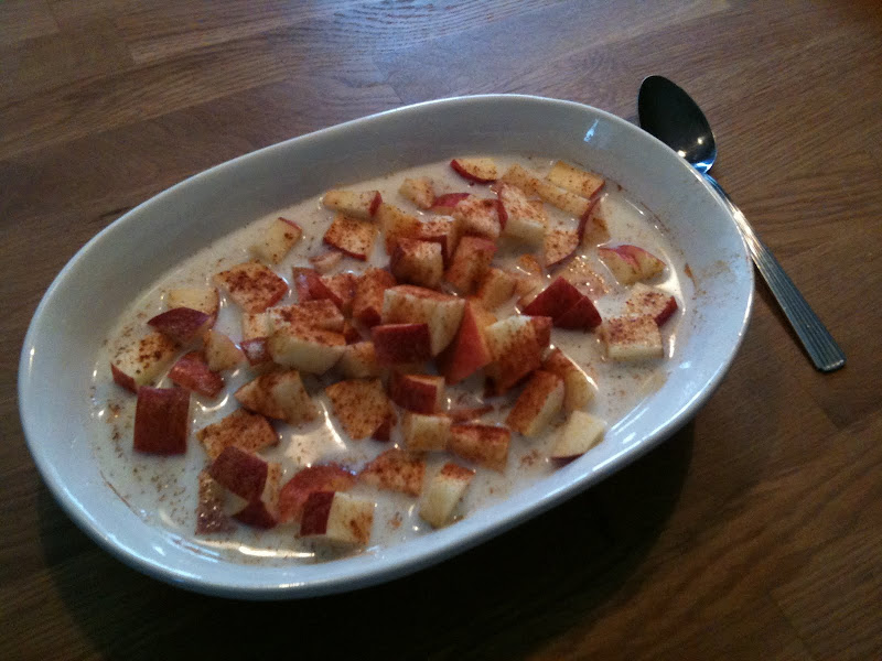 Bowl of Oatmeal, with chopped Apple, milk, cinnamon and sweetener