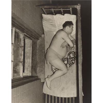 Weegee+-+man+sleeping+on+a+fire+escape,+1943.jpg