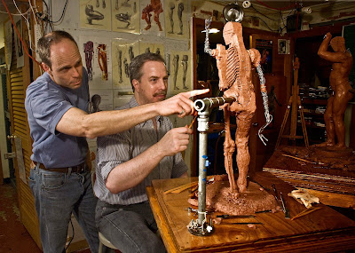 Anatomy Class Demonstration, partially completed sculpture during a class. Figure in background is the same life model sculpture, from a Figure Model Class.