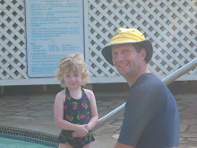 My dad and Hannah in the kiddy pool