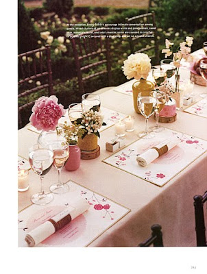 Who says that your table should be full of flowers A centerpiece of candles 