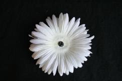 You start with a base flower (This is the very bottom of the flower that will clip into your hair)