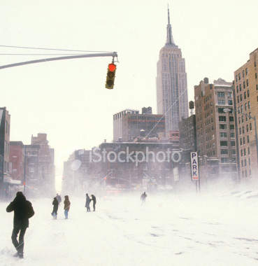 istockphoto_1439793-people-walking-streets-during-new-york-city-snow-storm.jpg