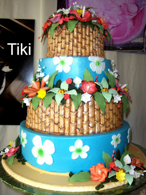 This new tropical themed cake has so many possibilitiesa Hawaiian wedding