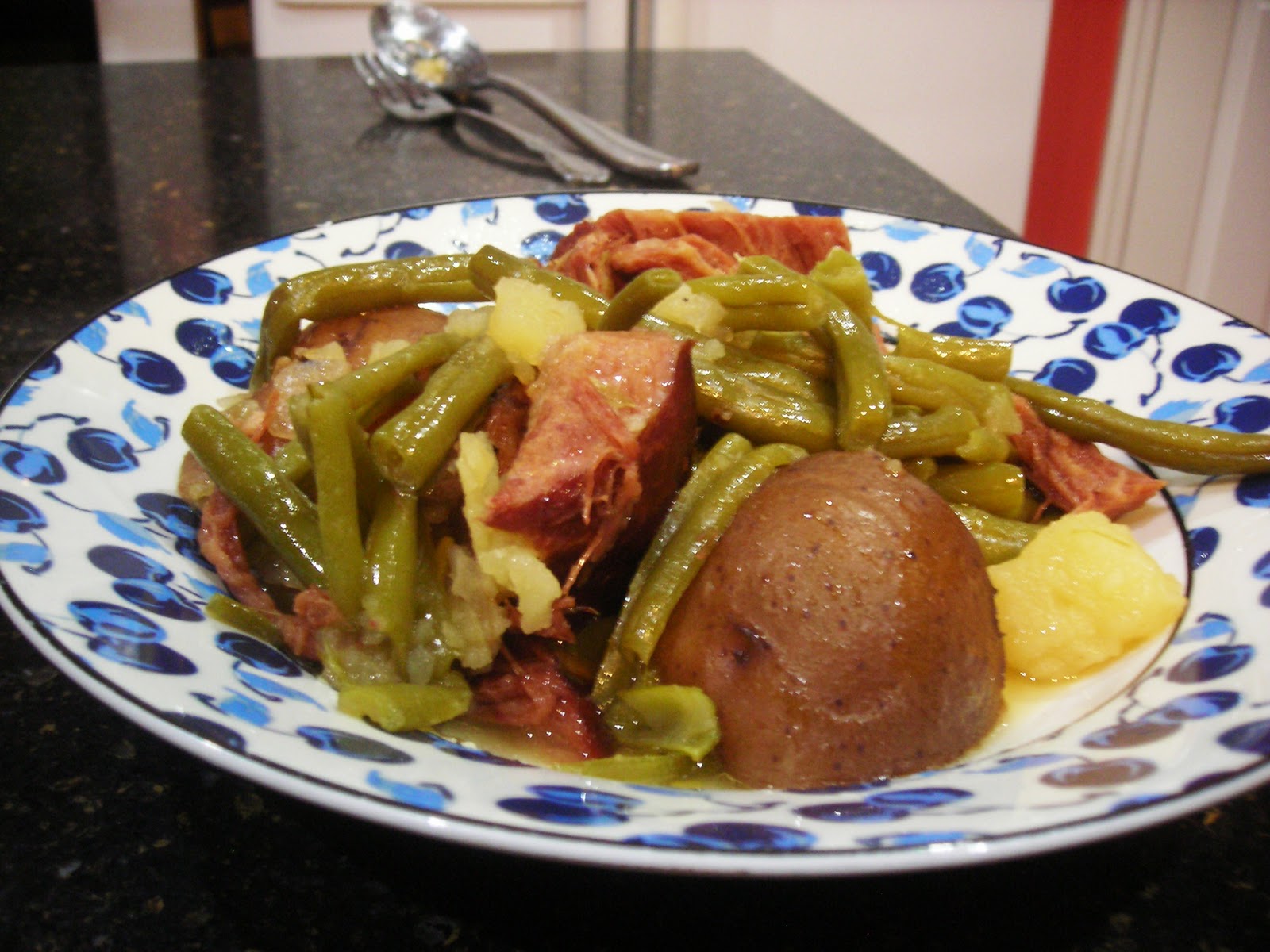 Family Cooking Wintery Cottage Ham with Green Beans and Red Potatoes