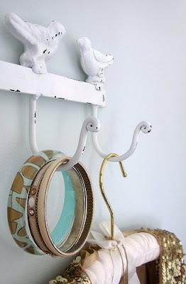 Bangle, bracelet and sequin cape on coat hanger hooks Bangle, bracelet and sequin cape on coat hanger hooks