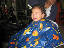 getting his hair cut