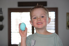 Luke coloring eggs