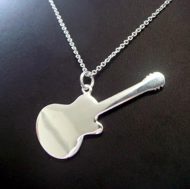 silver chain with guitar pendant