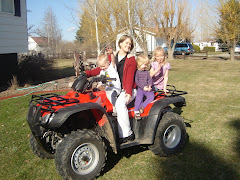 Our new 4-wheeler is so much fun.  Emily is giving some neighborhood kids a ride.