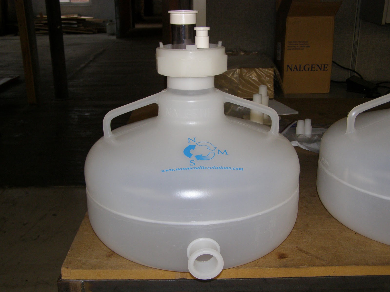 NonMetallic Solutions, Inc. NMS Customized Carboys