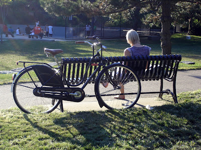 woman park bench bike Boston