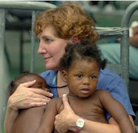 Photo of a woman and two children during relief work of Hurricane Katrina