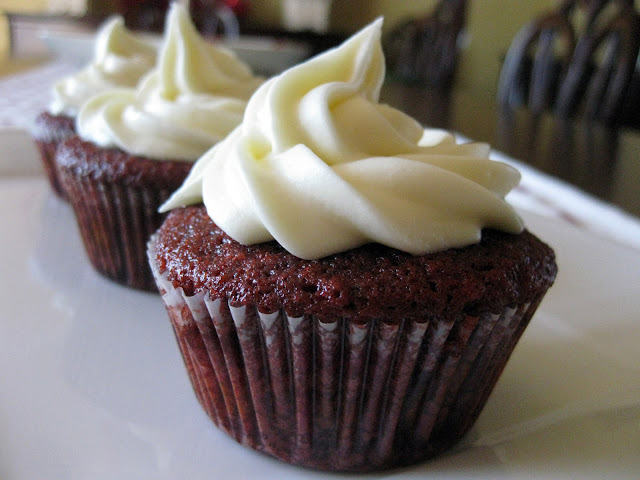 real red velvet cupcakes for christmas with cream cheese frosting and roux frosting. A great holiday cake.