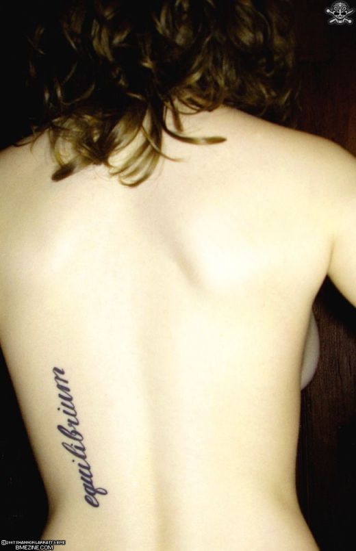 writing tattoos on back