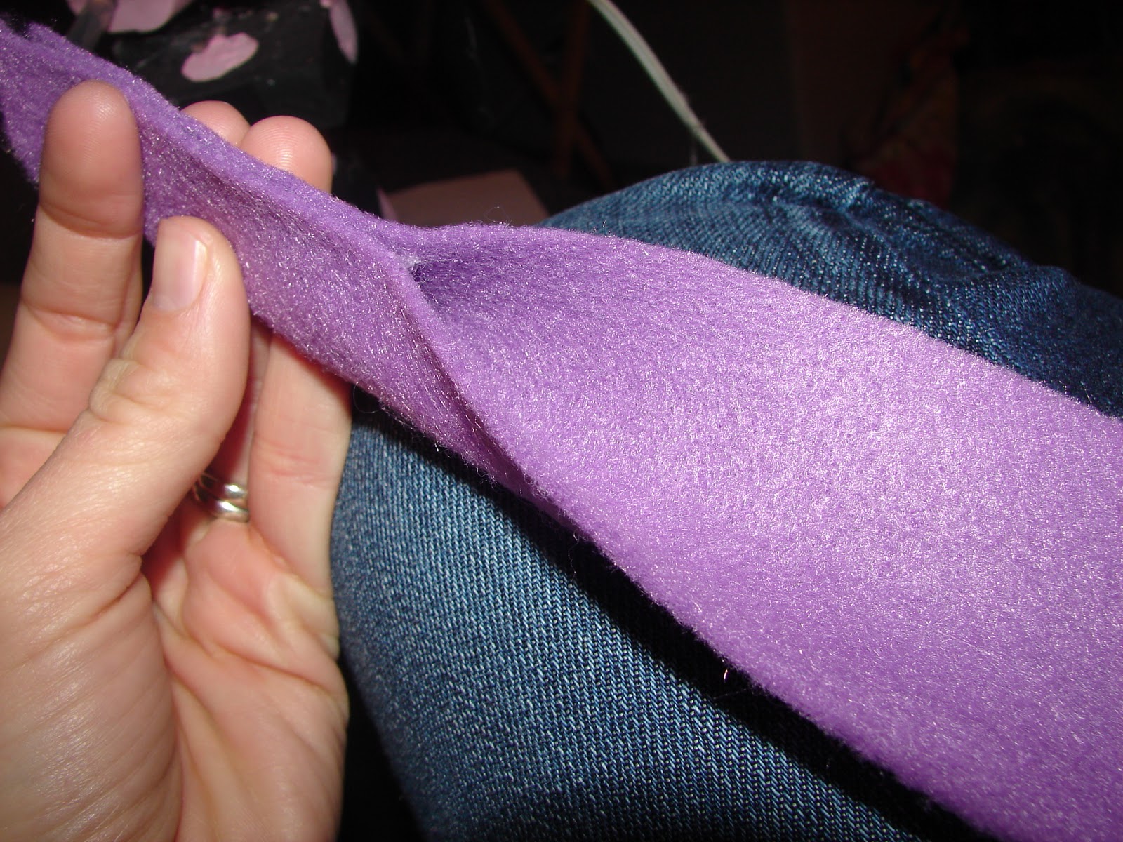 A girl and a glue gun felt flowers.