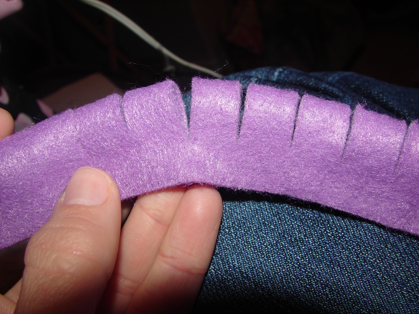 A girl and a glue gun felt flowers.