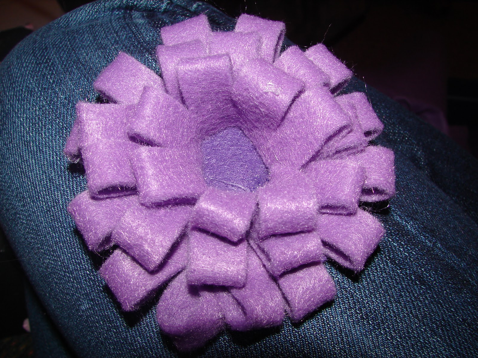 A girl and a glue gun felt flowers.