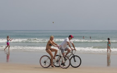 Image of bicyclists on beach at Daytona Beach