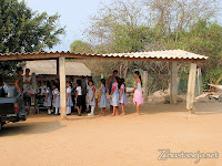 students lined up to receive donated supplies and clothing