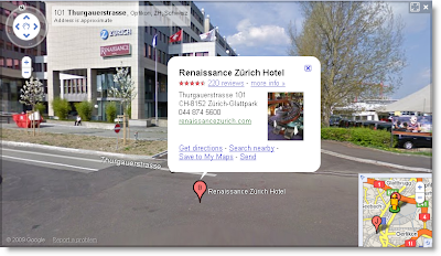 Ein Street View-Screenshot zeigt eine Straße mit einem Popup, das auf ein Hotel hinweist und Adresse sowie Telefonnummer beinhaltet