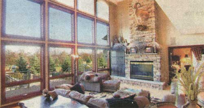 Lots of windows and a stone fireplace