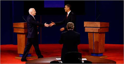 McCain and Obama reaching to shake hands on stage