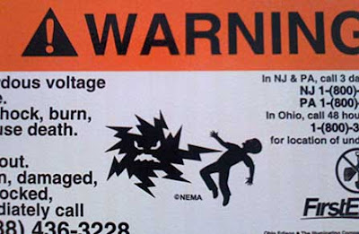 Warning sign with electrical shape zapping a man