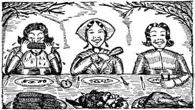 Three young people at a table with corn looking happy