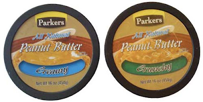 The tops of two peanut butter containers, one crunchy and one creamy