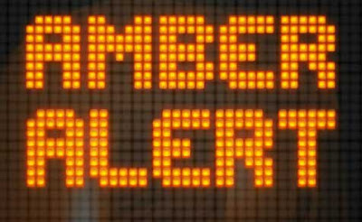 Light bulb sign reading AMBER ALERT