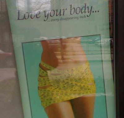 Lower torso of a thin woman wrapped in measuring tape like a skirt. Headline reads Love Your Body (every disappearing inch)