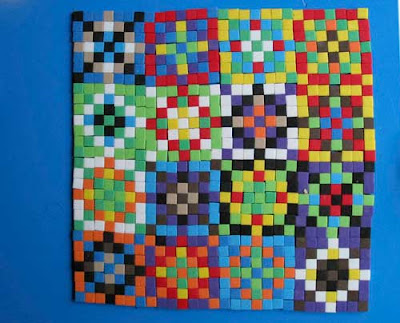 Small multicolored squares assembled into a quilt pattern