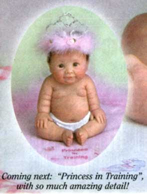 Another white baby figurine, this time with a pink feathery crown