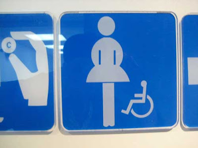 Female figure with a single leg and narrow vertical slots, with smaller wheelchair icon to the right